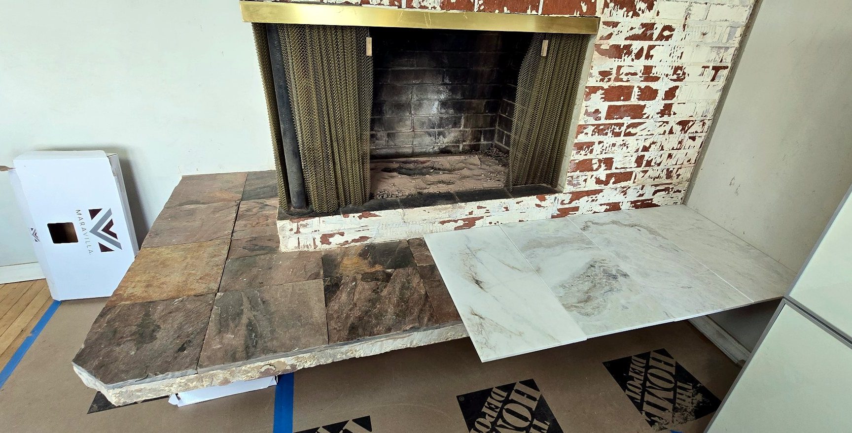 Porcelain tile dry-laid on the lower hearth before setting