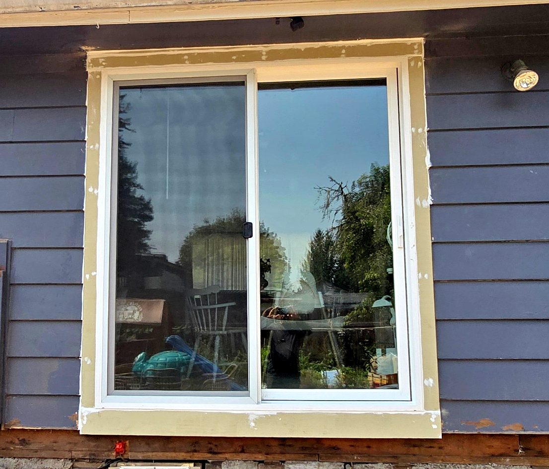 New sliding patio door with new exterior trim on a Portland home