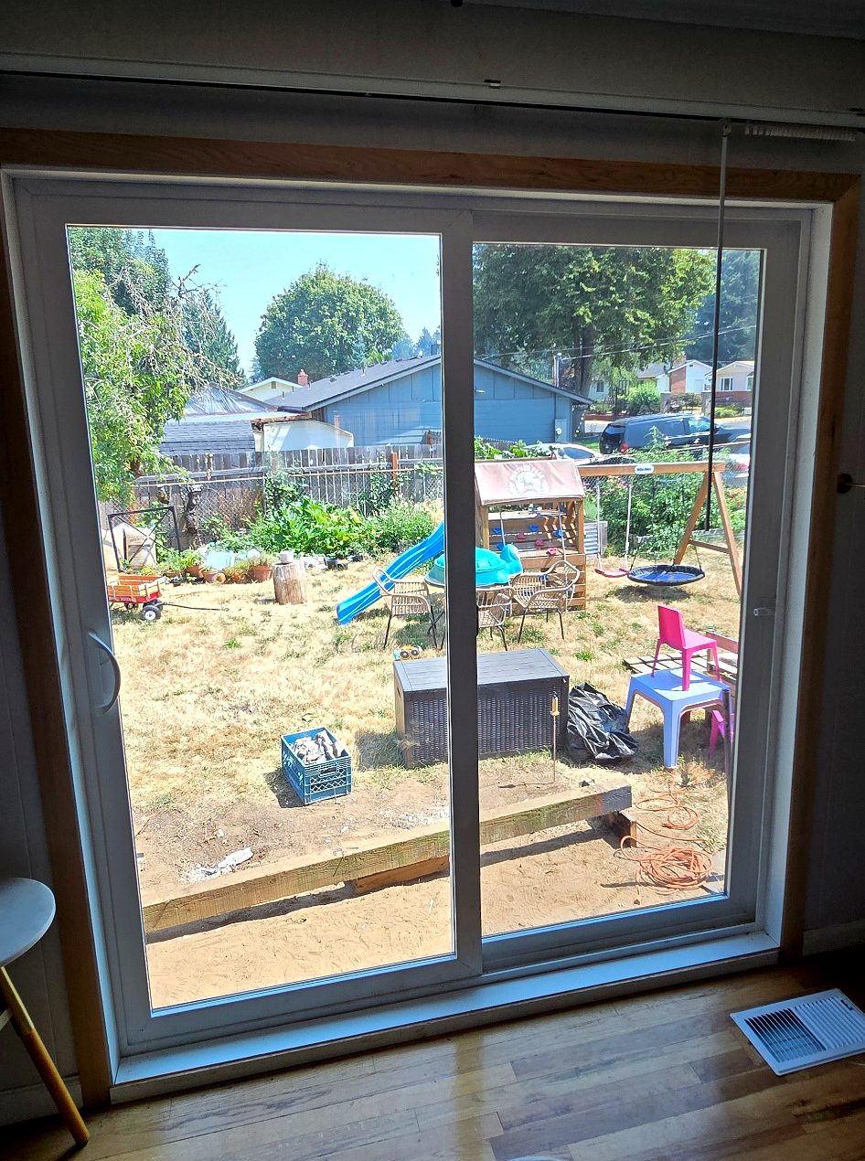 New patio door seen from inside the room with the jamb ready for interior trim