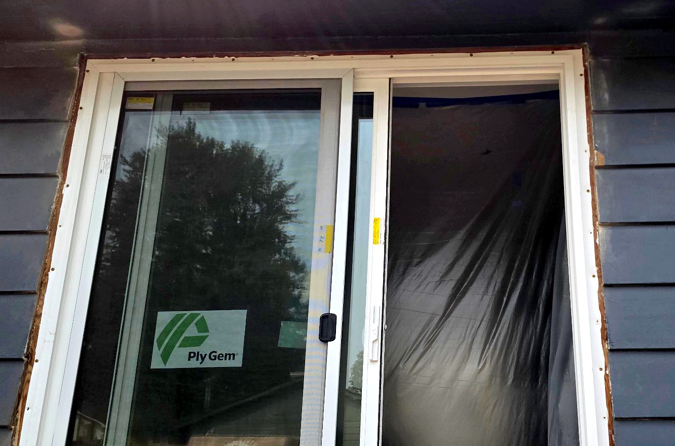 New sliding patio door set, leveled and squared in the opening