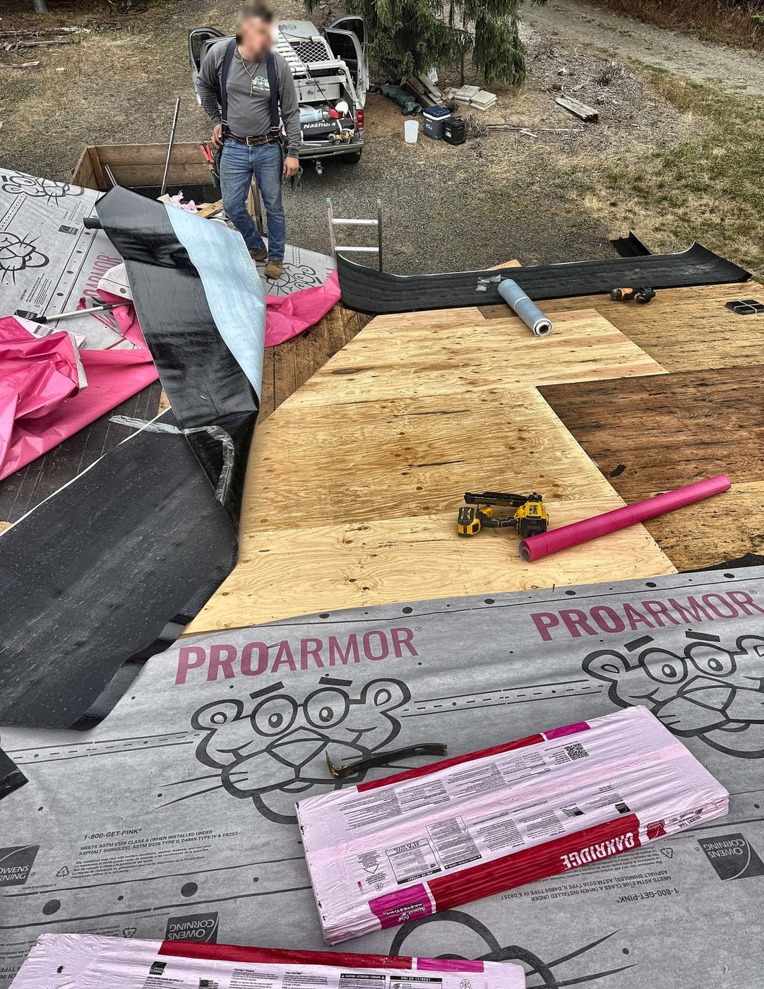 New plywood roof decking installed with drip edge and synthetic underlayment staged during roof replacement